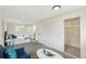 Bright bedroom with large closet and updated bathroom featuring a small workstation at 8622 W Warren Ln, Lakewood, CO 80227