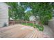 Wood deck and grassy backyard provide an ideal space for outdoor living and entertaining at 5602 S Yank Ct, Littleton, CO 80127