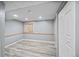 Finished basement area with light grey walls, wood-look floors, and recessed lighting offers a versatile space at 5602 S Yank Ct, Littleton, CO 80127