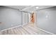 Spacious basement with durable flooring, access to other rooms, and ample natural light makes it inviting at 5602 S Yank Ct, Littleton, CO 80127
