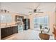 Bright kitchen featuring dark cabinetry, stainless steel appliances, tile floors, and a sliding glass door to a deck at 5602 S Yank Ct, Littleton, CO 80127