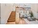 Cozy living room with an upstairs loft, hardwood floors, and a comfortable sitting area that offers a welcoming space at 5602 S Yank Ct, Littleton, CO 80127