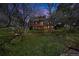 Scenic two-story home with multiple balconies, enveloped by lush greenery and a serene lawn at 6275 Lakewood Rd, Parker, CO 80134