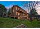 Expansive two story home features a walkout basement and sprawling lawn at 6275 Lakewood Rd, Parker, CO 80134