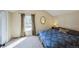 Comfortable bedroom with a plush carpet, large window, and warm, inviting natural light at 6275 Lakewood Rd, Parker, CO 80134