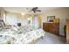 Spacious bedroom with soft carpet and a view into the adjoining bath and closet areas at 6275 Lakewood Rd, Parker, CO 80134