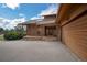 Exterior view showing the porch and covered parking of this stunning home at 6275 Lakewood Rd, Parker, CO 80134