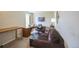 Comfortable home office features a couch and a large desk for working at home at 6275 Lakewood Rd, Parker, CO 80134