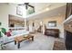Spacious living room featuring vaulted ceilings, a brick fireplace, and an open floor plan at 6275 Lakewood Rd, Parker, CO 80134