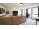 Spacious living room with carpet floors, a large couch, and multiple windows with natural light at 6275 Lakewood Rd, Parker, CO 80134