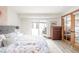 Bedroom featuring a comfortable bed, wooden dresser, and glass doors to outdoor view at 186 Rachel Ln, Breckenridge, CO 80424