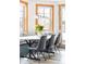 Bright dining area featuring large windows, banquette seating, pendant lighting, and wood-look floors at 186 Rachel Ln, Breckenridge, CO 80424