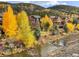Scenic home exterior featuring a mountain stream and vibrant autumn foliage at 186 Rachel Ln, Breckenridge, CO 80424