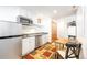 Efficient kitchen with stainless steel appliances, white cabinets, and adjacent dining area at 186 Rachel Ln, Breckenridge, CO 80424