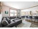 Open-concept living space with wood floors, large window, and connection to the dining area and kitchen at 186 Rachel Ln, Breckenridge, CO 80424