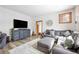 Comfortable living room showcasing a large sectional sofa, entertainment center, and wood-look flooring at 186 Rachel Ln, Breckenridge, CO 80424