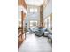 Bright living room featuring a stone fireplace, vaulted ceilings, and ample natural light at 186 Rachel Ln, Breckenridge, CO 80424