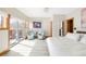 Light-filled bedroom boasting balcony access, comfortable seating area, and elegant decor at 186 Rachel Ln, Breckenridge, CO 80424