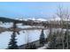 Scenic view of snow-capped mountains under a blue sky from balcony at 186 Rachel Ln, Breckenridge, CO 80424
