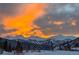 Dramatic mountain views at sunset with snow-covered peaks and clouds at 186 Rachel Ln, Breckenridge, CO 80424