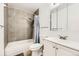 Updated bathroom featuring tiled shower, modern vanity, and functional layout at 3225 S Garrison St # 9, Lakewood, CO 80227