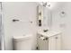 Clean bathroom featuring a modern toilet, a sink with vanity and a towel rack at 3225 S Garrison St # 9, Lakewood, CO 80227