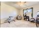 Bright bedroom with a ceiling fan, a chair, and a window at 3225 S Garrison St # 9, Lakewood, CO 80227
