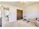 Bedroom featuring carpeting, a ceiling fan, and closet with doors at 3225 S Garrison St # 9, Lakewood, CO 80227