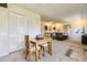 Open dining area featuring modern decor and seamless transition to the inviting living space at 3225 S Garrison St # 9, Lakewood, CO 80227
