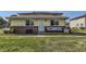 Front exterior of home with well-maintained lawn, vinyl siding and attractive front porch seating at 3225 S Garrison St # 9, Lakewood, CO 80227