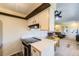 Kitchen features an electric stove, white countertops, and a view into the living room at 3225 S Garrison St # 9, Lakewood, CO 80227
