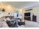 Comfortable living room with a large sectional sofa, neutral carpeting, and ample natural light at 3225 S Garrison St # 9, Lakewood, CO 80227