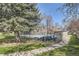 Community pool with a fence surrounded by greenery at 3225 S Garrison St # 9, Lakewood, CO 80227