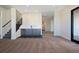 Finished basement with stylish wet bar, stairs, and open layout at 5741 Doc Bar Circle, Larkspur, CO 80118