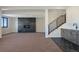 Finished basement with sleek fireplace and wet bar at 5741 Doc Bar Circle, Larkspur, CO 80118