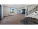 Finished basement showcasing fireplace, wet bar, and natural light at 5741 Doc Bar Circle, Larkspur, CO 80118