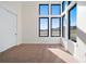A bright and spacious room with natural lighting and many large windows at 5741 Doc Bar Circle, Larkspur, CO 80118