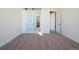 An empty room with tan carpet features natural lighting, and a closet with a sliding door at 5741 Doc Bar Circle, Larkspur, CO 80118