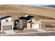 Attractive home boasting a stone-accented exterior, contemporary design, and well-manicured landscaping at 5741 Doc Bar Circle, Larkspur, CO 80118