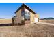 Stunning exterior elevation of home with natural surroundings at 5741 Doc Bar Circle, Larkspur, CO 80118