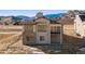 Imposing two-story home with stone accents, spacious windows, and a well-designed architectural style at 5741 Doc Bar Circle, Larkspur, CO 80118