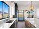Gourmet kitchen with quartz countertops, stainless steel appliances, and a seamless indoor-outdoor transition at 5741 Doc Bar Circle, Larkspur, CO 80118
