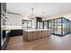 Spacious kitchen boasting a large island, modern appliances, and an open layout ideal for entertaining at 5741 Doc Bar Circle, Larkspur, CO 80118