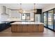 Stunning kitchen featuring a large island, custom cabinets, and an open layout perfect for gatherings at 5741 Doc Bar Circle, Larkspur, CO 80118
