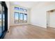 Open living room with large windows offering panoramic views of the surrounding landscape at 5741 Doc Bar Circle, Larkspur, CO 80118
