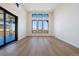 Spacious living room with an outdoor patio and abundant natural light from large windows at 5741 Doc Bar Circle, Larkspur, CO 80118