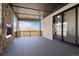Large patio with a stone fireplace and scenic views of the surrounding landscape at 5741 Doc Bar Circle, Larkspur, CO 80118