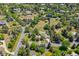 Aerial view of the property showcasing its location in a green, tree-filled neighborhood at 4500 S Dasa Dr, Cherry Hills Village, CO 80111