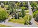 Aerial view showing a home surrounded by mature landscaping, trees, and a well-manicured lawn at 4500 S Dasa Dr, Cherry Hills Village, CO 80111