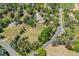 Expansive aerial view showcasing a lush, green property with mature trees and well-maintained landscaping at 4500 S Dasa Dr, Cherry Hills Village, CO 80111